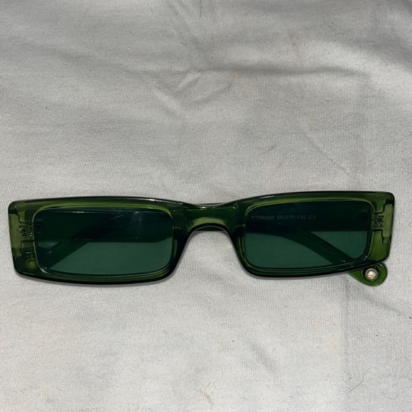 Accessories - Green rectangular shaped sunglasses.